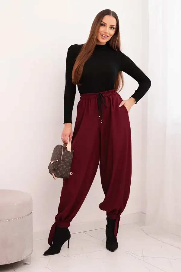 Kesi Włoski Kesi Włoski Women’s trousers with wide legs and ties at the bottom burgundy