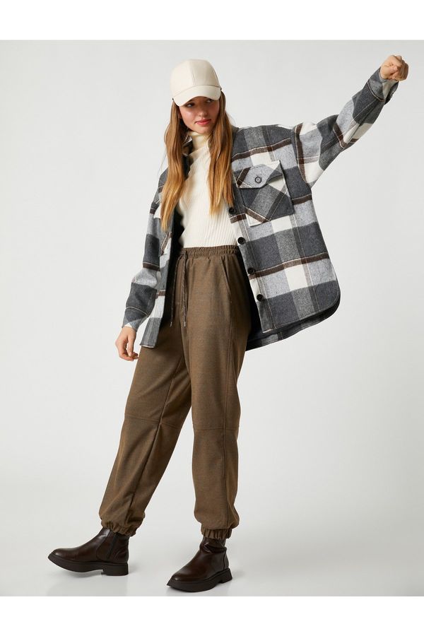 Koton Котон Джогър панталон с ластик на талията и дантелена материя.