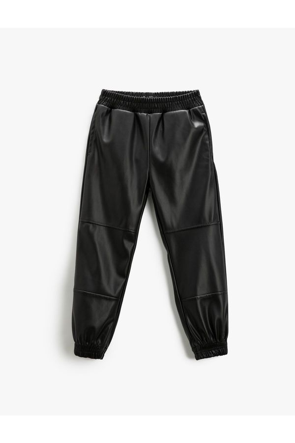 Koton Koton Leather Look Jogger Pants with Elastic Waist and Pockets.