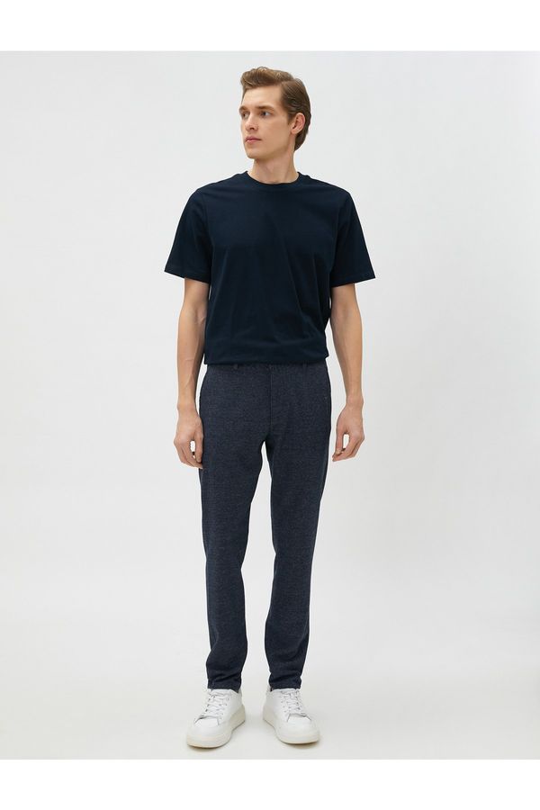 Koton Koton Woven Trousers with Crowbarn Detailed Buttons and Pockets.