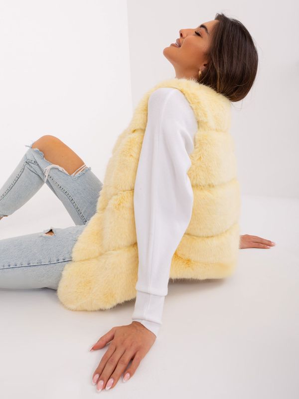 Fashionhunters Light yellow fur vest with pockets