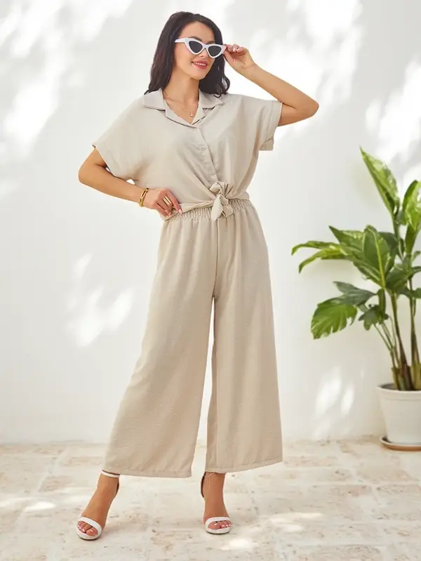 Resti Resti Women's set with a tied short-sleeve shirt and flared pants with rhinestones