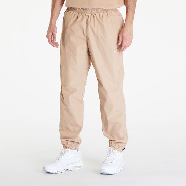 Nike Панталони Nike x NOCTA Woven Track Pants Hemp/ Sanddrift XS