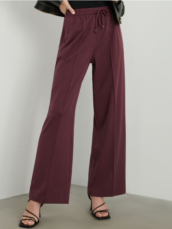 Sinsay Sinsay - Панталони с широки крачоли - кестеняв